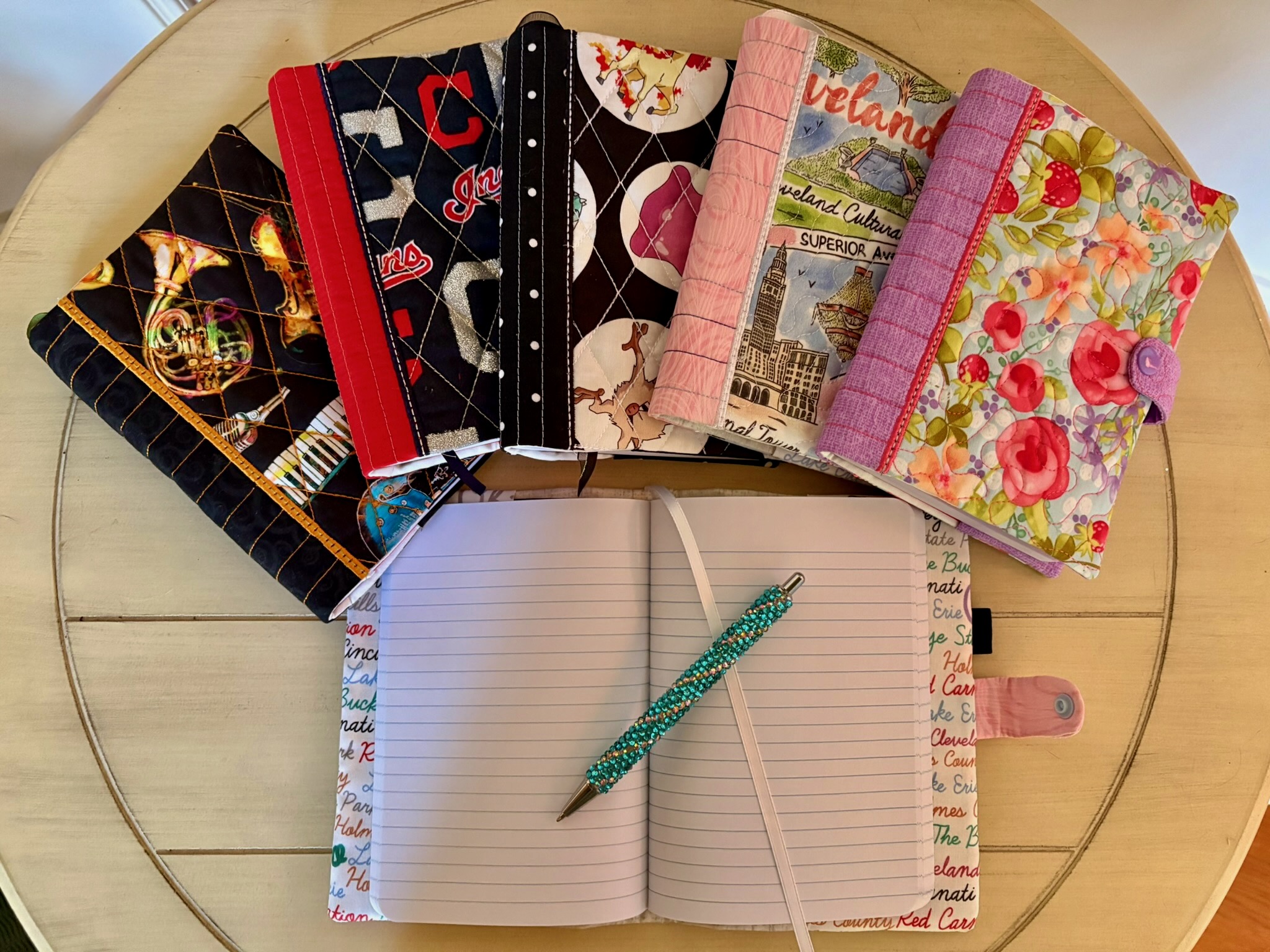Fabric-covered journals with pen holder